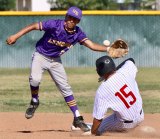 Lemoore High's Isaiah Gonzales attempts a putout on Hanford's Dominic McLaughlin at second base. The Tigers beat the Bullpups 9-3 Wednesday afternoon.